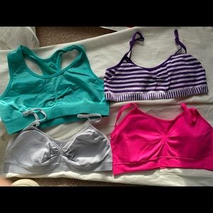 Bundle of four girls sports bras